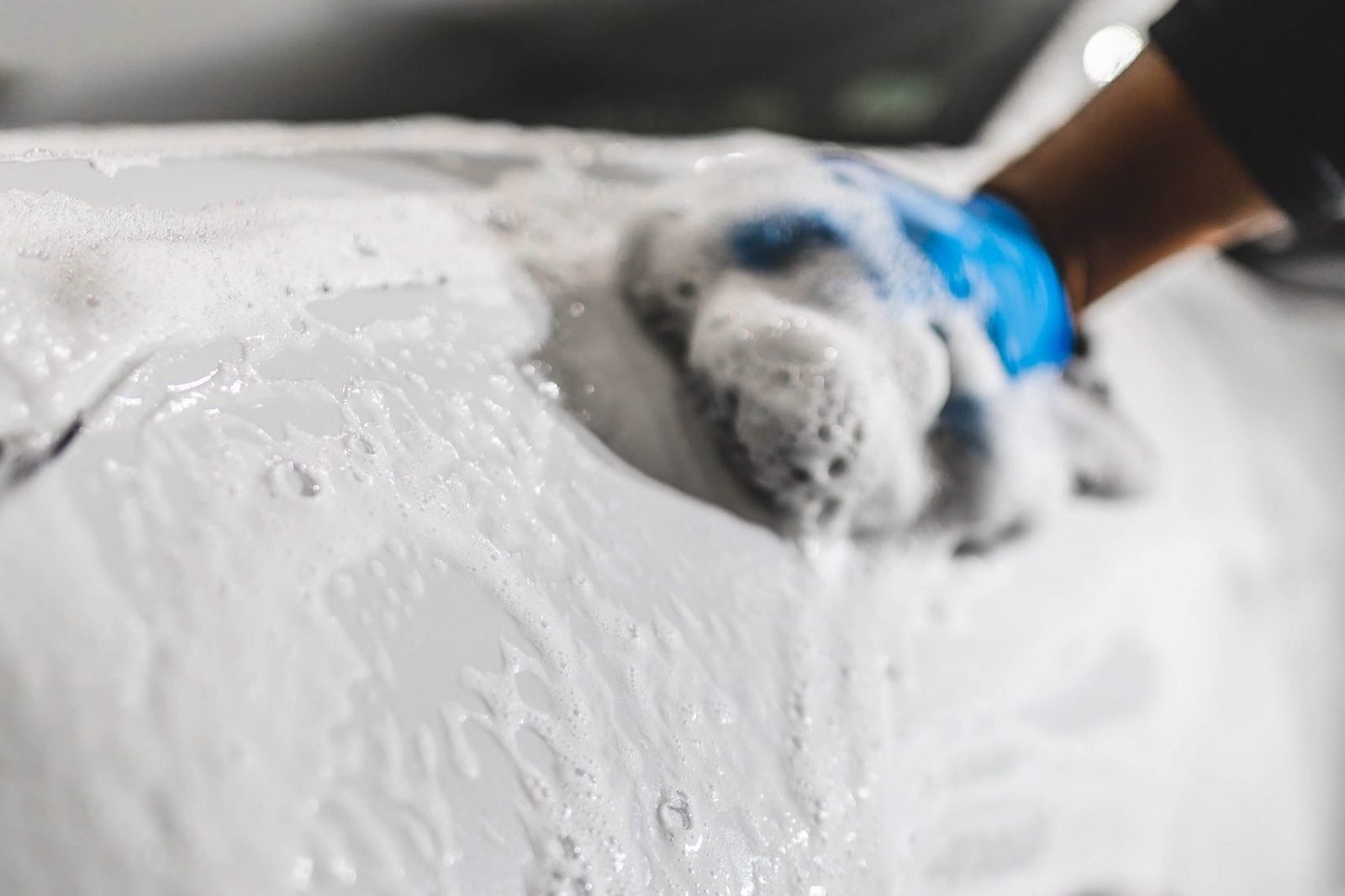 Controlled low pressure rinse used during engine bay cleaning