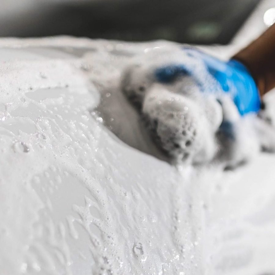 Controlled low pressure rinse used during engine bay cleaning