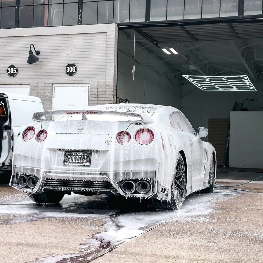 Sports car covered in foam during a safe two bucket hand wash