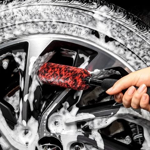 Wheel brush cleaning a foam covered wheel